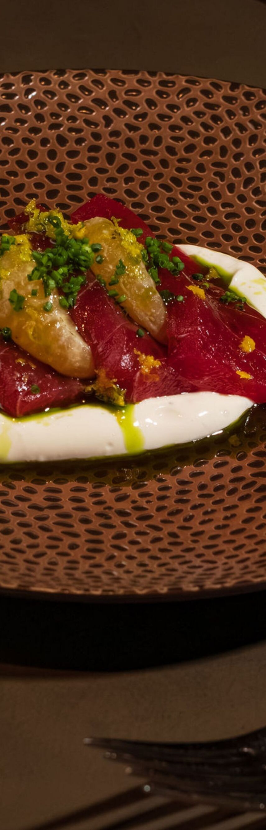Gourmet plated dish featuring seared meat