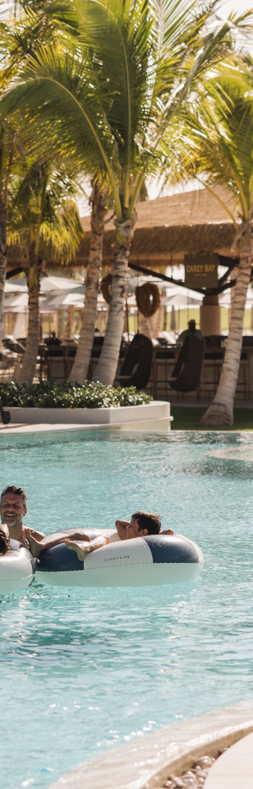 Family having fun together at the main pool
