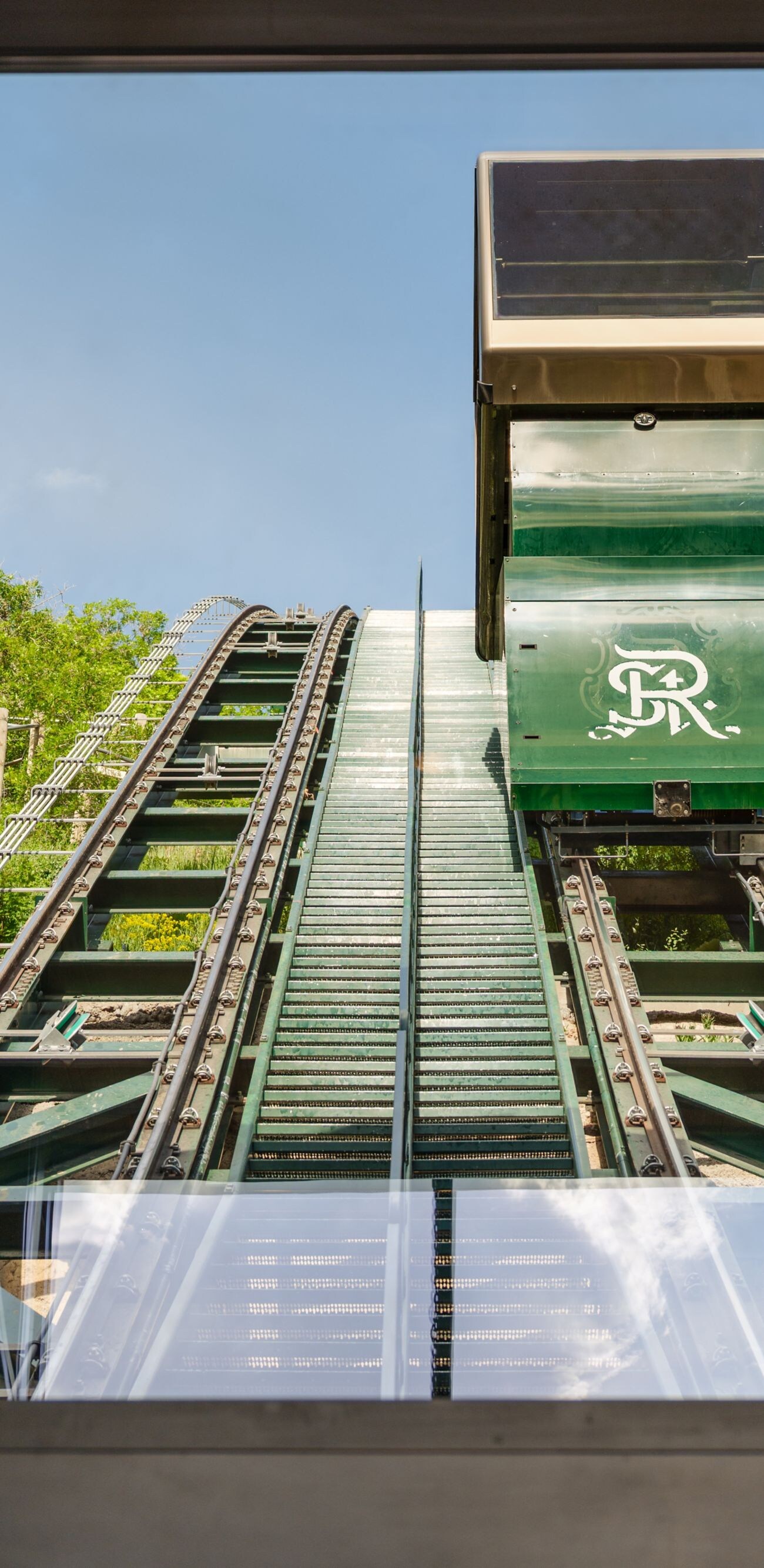 cars on tracks going up hill