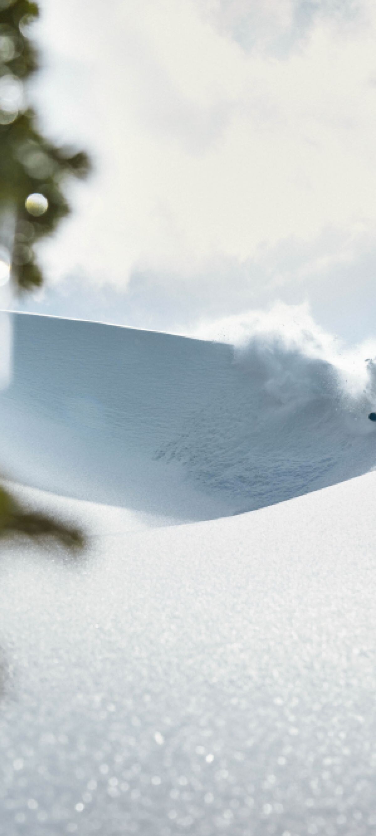 A skier leaves a wake as they ski the mountain