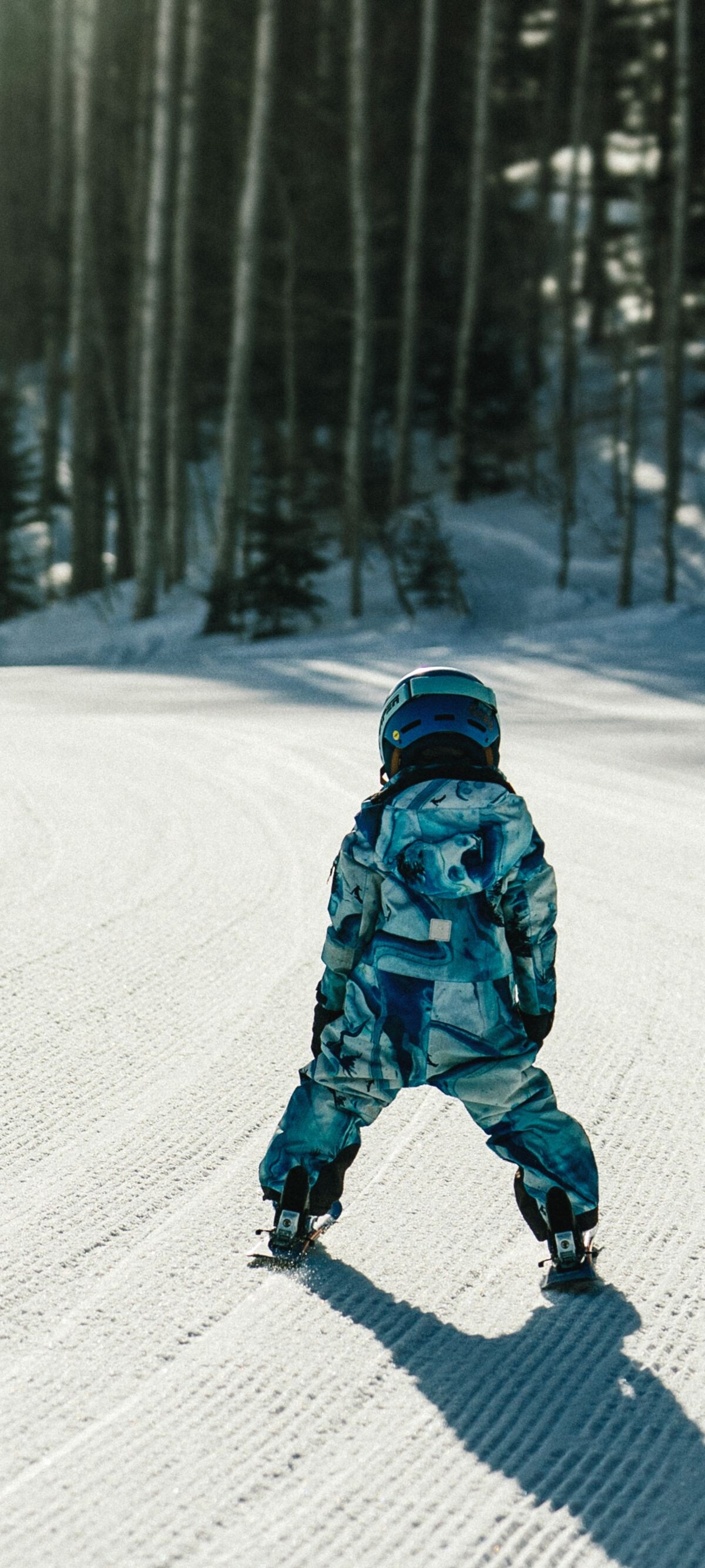A child skis down Deer Valley Mountain
