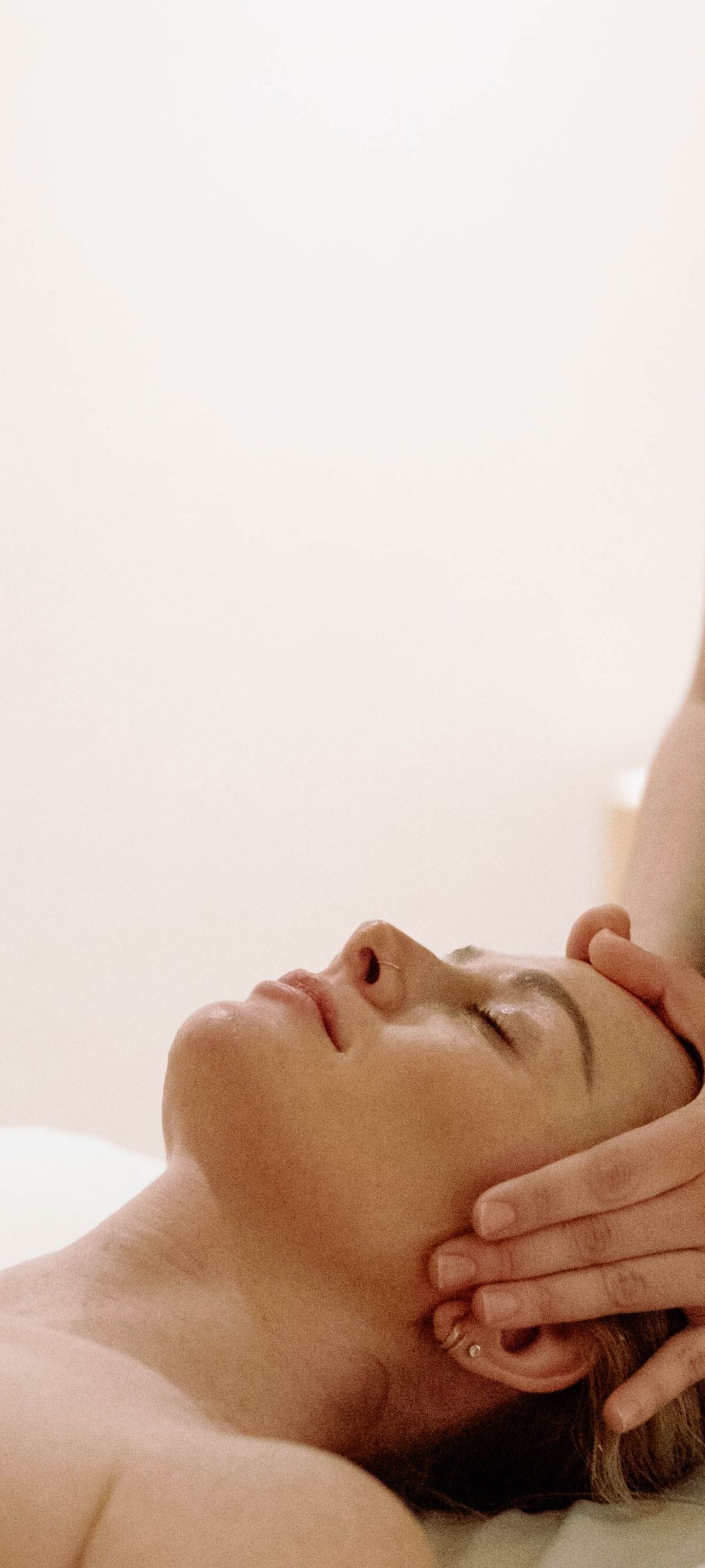 a woman gets a Head Massage in the Spa