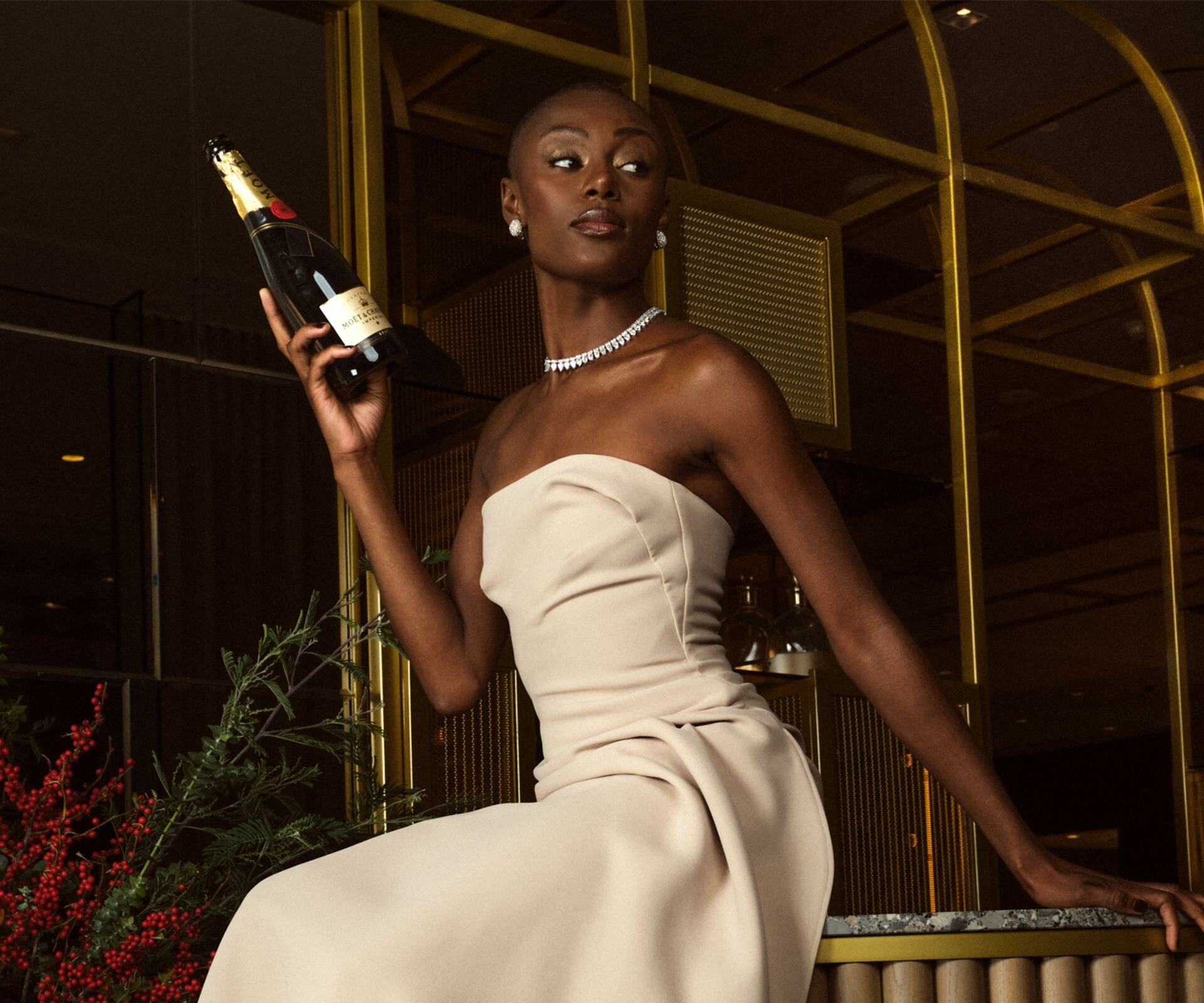 glamorous female dressed in cream holiday gown, 