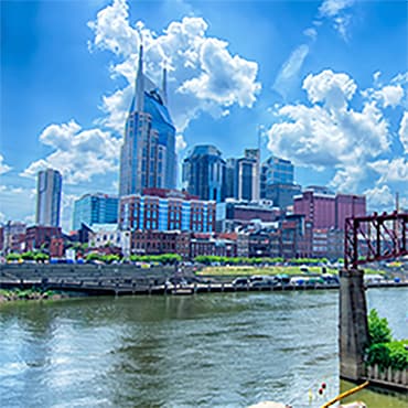 Nashville skyline in background with river in foreground.