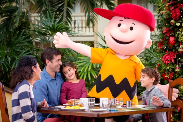 Family eating breakfast with Charlie Brown
