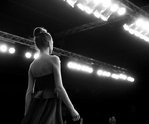 woman in gown on stage