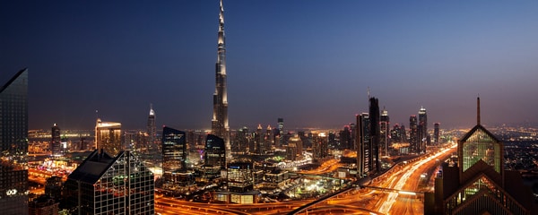 Burj Khalifa amidst city skyline at night