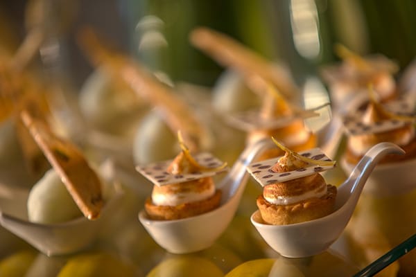 Small layered desserts arranged in sampling spoons