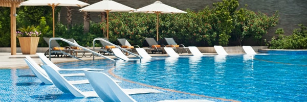 Lounge chairs at edge of pool
