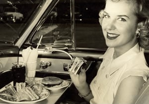 Enjoying in-car dining, 1952.