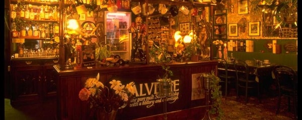 Warm lights brighten a cosy, traditional Scottish pub in Edinburg, Scotland