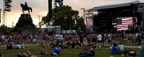 Music fans sit on the lawn at the Made in America music festival in Philadelphia
