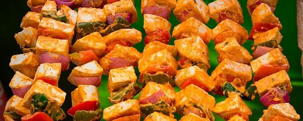 Indian paneer kabobs, cooked in a tandoori oven, are served at a local restaurant in San Diego, California