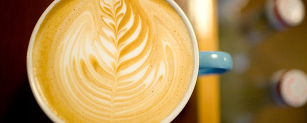 Seattle latte art in coffee mug.