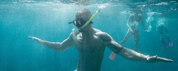 Snorkelers explore underwater reefs off Australia's Gold Coast