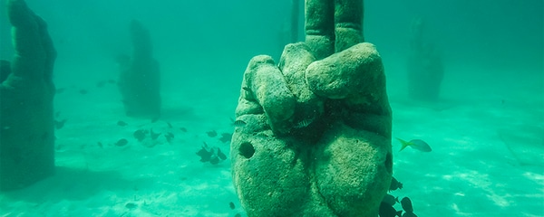 Hand sculptures at an underwater museum in Cancun.