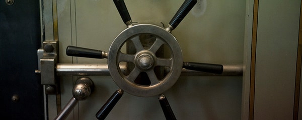 Close up view of an antique vault at a bank.