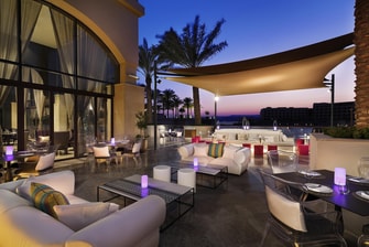 Enjoy the timeless setting and exquisite views of the lagoon at Kubba Levantin, where sophisticated cocktails and conversation flow.