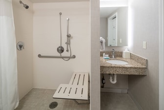 Suite ADA accessible bathroom with roll-in shower or tub