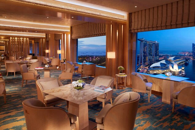 Club Lounge with window seats and views of  Marina Bay.