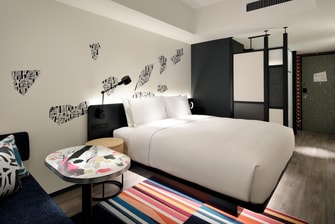 The Aloft King Guest Room features an ultra-comfortable king size bed.